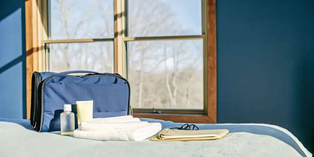 Packed travel bag with comfortable clothing and personal items for inpatient rehab